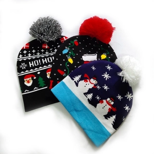 Detailed knit patterns of Christmas beanies featuring Santa, snowmen and colorful lights