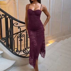 Elegant purple lace tube dress with asymmetric hem on a luxury staircase background