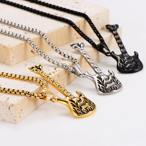 Three retro stainless steel guitar necklaces in gold, silver, and black finish