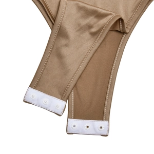 Detail of the elastic fabric crotch with three white snap buttons on the bodysuit