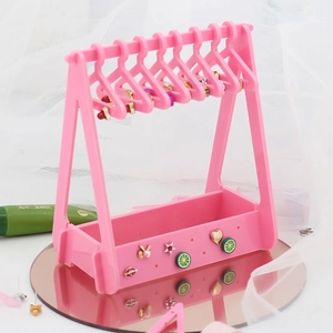 Pink acrylic clothes hanger earring rack with mini hangers and cute decorative charms