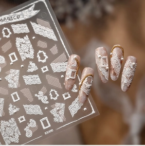 Macro detail of KX490 luxury white 3D lace nail stickers with pearl and frame patterns