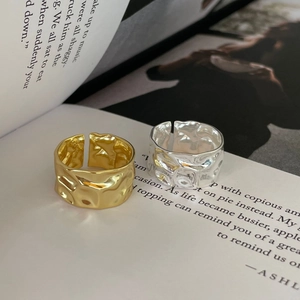 Minimalist S925 sterling silver irregular ring in gold and silver finish on book