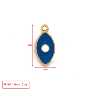 Macro detail of blue evil eye charm with gold frame showing 12mm size and weight
