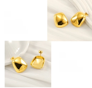 Detailed view of square gold stud earrings showing polished mirror finish and craftsmanship