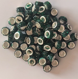 Macro shot of 7x12mm green rhinestone large hole beads with silver metal inner cores