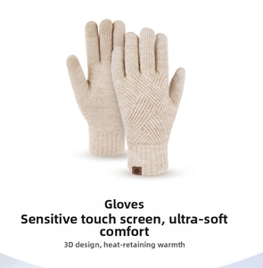 Detail of cream knitted gloves showing cross-weave texture and touchscreen fingertips