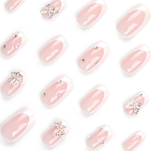 French tip press-on nails with pink base, 3D silver butterflies, and sparkling rhinestones