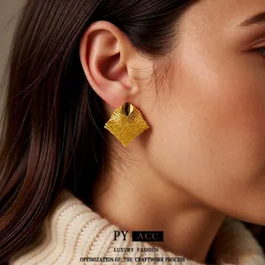 18k gold plated rhombus stud earrings with woven texture on elegant female model