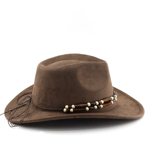 Close-up of the beaded hatband and suede texture on a dark brown western cowboy hat