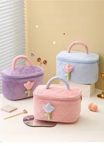 Detailed corduroy cosmetic bags with tulip patches and quilted texture in three soft colors
