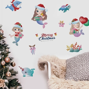 Detail of Christmas mermaid wall decals with sea animals and Merry Christmas text decor