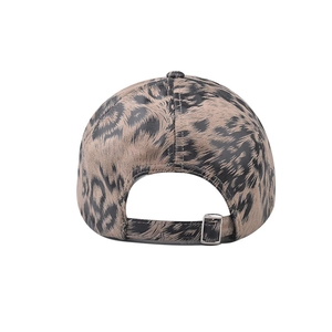 Detail of adjustable metal buckle and leopard print cotton fabric on the baseball cap