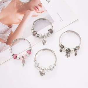 Adjustable charm bracelets with dreamcatcher and angel wing pendants in pastel tones
