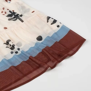 Detail of printed mesh hem featuring multi-color stripes and artistic abstract motifs