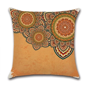 Linen cushion cover featuring a vibrant orange mandala ethnic geometric pattern