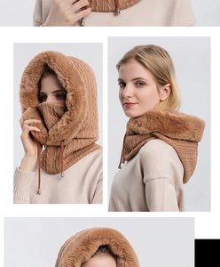 Detail of brown cable knit winter hood with faux fur trim and adjustable drawstring