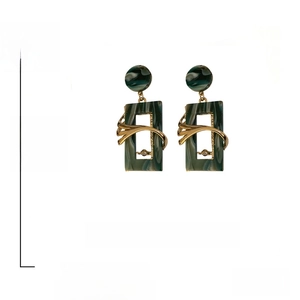 Detail view of retro green acrylic earrings with crystal inlay measuring 4.9cm by 2.4cm