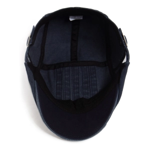 Inside view of navy blue washed ivy cap showing sweatband, lining and metal buckle