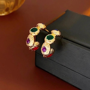 Vintage gold-textured C-shape hoop earrings with multicolored faceted gemstones