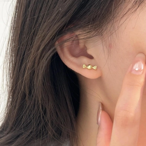 Chic 925 sterling silver candy-shaped stud earrings in polished gold finish on ear