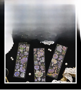 Macro detail of dazzling floral PET stickers with gold foil stamping and butterfly motifs