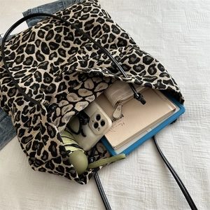 Leopard print canvas tote bag with large capacity showing internal storage and items