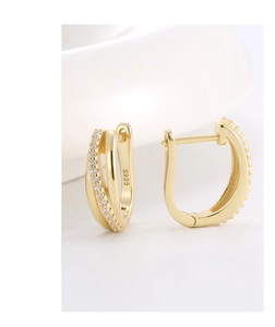 Detailed macro view of S925 sterling silver gold earrings with micro-pave zircon crystals
