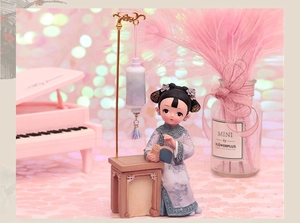 Detailed resin Chinese girl figurine holding a scroll next to a lantern in dreamlike setting