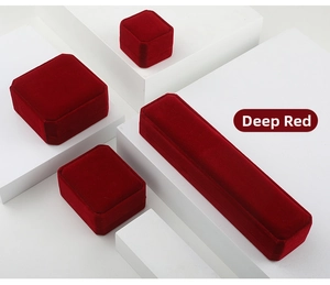 Detailed set of premium dark red velvet jewelry boxes for rings and necklaces