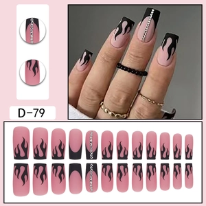 Matte nude and black flame press-on nails with silver rhinestones and french tips