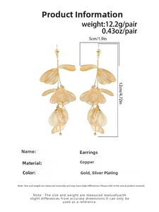 Close-up of golden ginkgo leaf earrings with brushed texture details and dimensions
