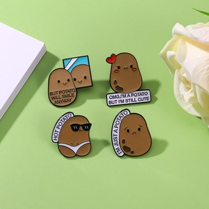 Set of four cute cartoon potato enamel pins with funny expressions and sayings