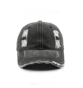 Front view of charcoal gray washed cotton baseball cap with distressed hole details