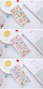 Detailed view of three 3D puffy cartoon sticker sheets with cute animals and unicorns