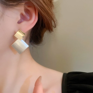 Minimalist geometric square stud earrings with gold and silver two-tone metallic finish