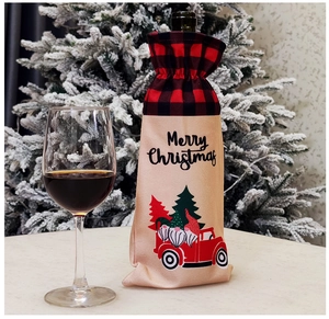Detail of Christmas wine bottle cover with plaid drawstrings and Merry Christmas print