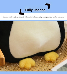 Close-up detail of the soft fluffy texture and full filling of penguin plush toy