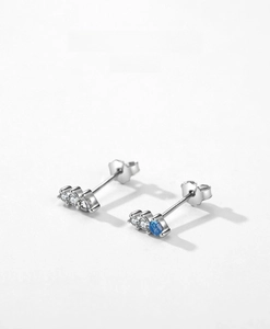 Detailed shot of S925 silver stud earrings with blue and white zircon stone inlay