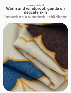 Detail of warm windproof knit scarf for kids with blue and brown geometric patterns