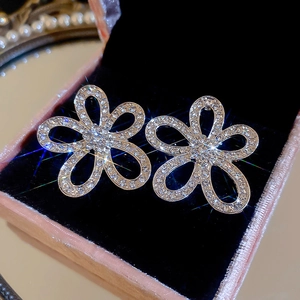 Luxury sparkling silver floral stud earrings with rhinestones in a premium jewelry box