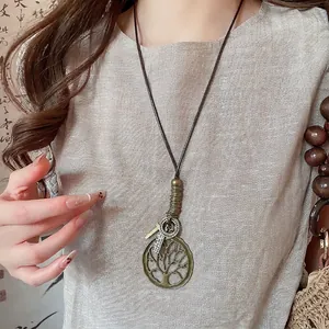 Vintage bronze Tree of Life pendant necklace with custom engraved tags on a long cord