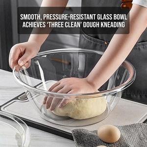 Transparent large mixing bowl for kneading dough in a home kitchen setting