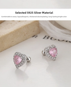 Macro detail of 925 silver heart earring with pink zircon and secure screw-back ball