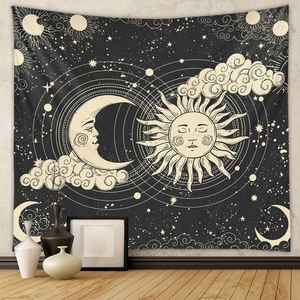 Detailed view of sun and moon astrology tapestry on wall with bohemian home decor accents