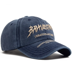 Navy blue washed cotton baseball cap with gold Bravestorm embroidery and curved brim