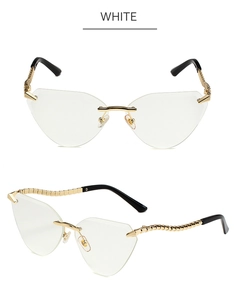 Detail of gold metal temples with snake texture on rimless cat eye sunglasses