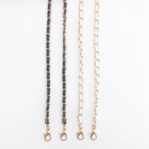 Faux leather and gold metal interwoven crossbody bag chain straps in black and white