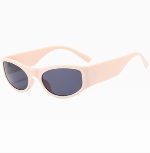 Detailed view of peach pink oval sunglasses frame with dark grey anti-UV lenses