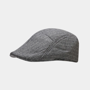 Detail view of British style dark grey ivy cap with classic white pinstripe texture